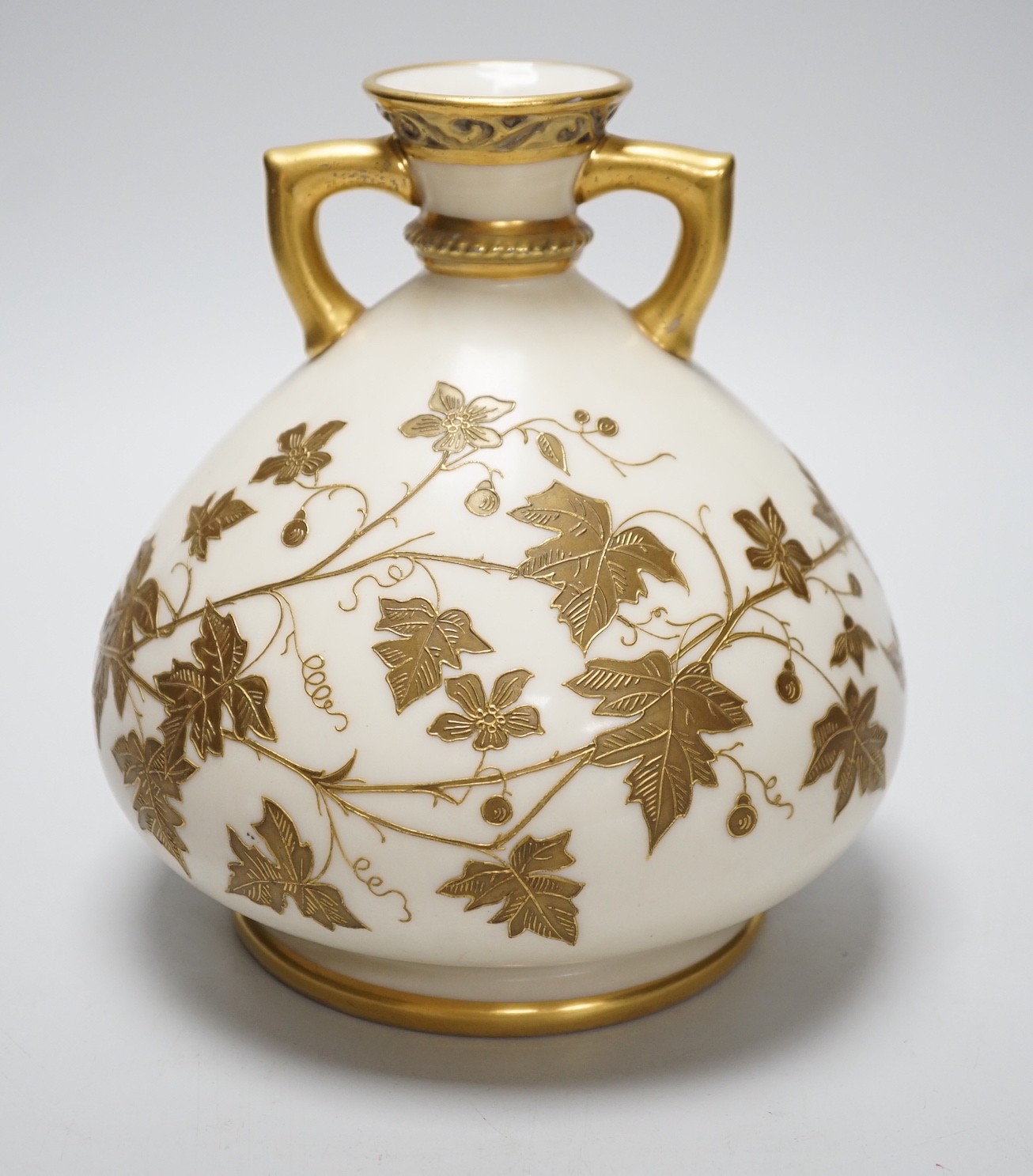 A Royal Worcester gilded vase of bulbous form, 17cm